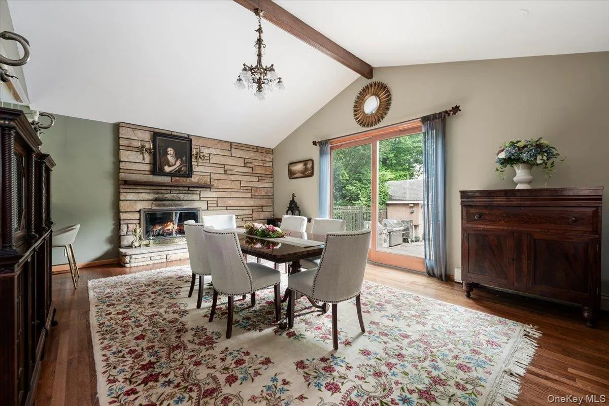 DR w/ wood burning fireplace, slider to deck, wet bar w/ wine fridge DR w/ wood burning fireplace, slider to deck, wet bar w/ wine fridge