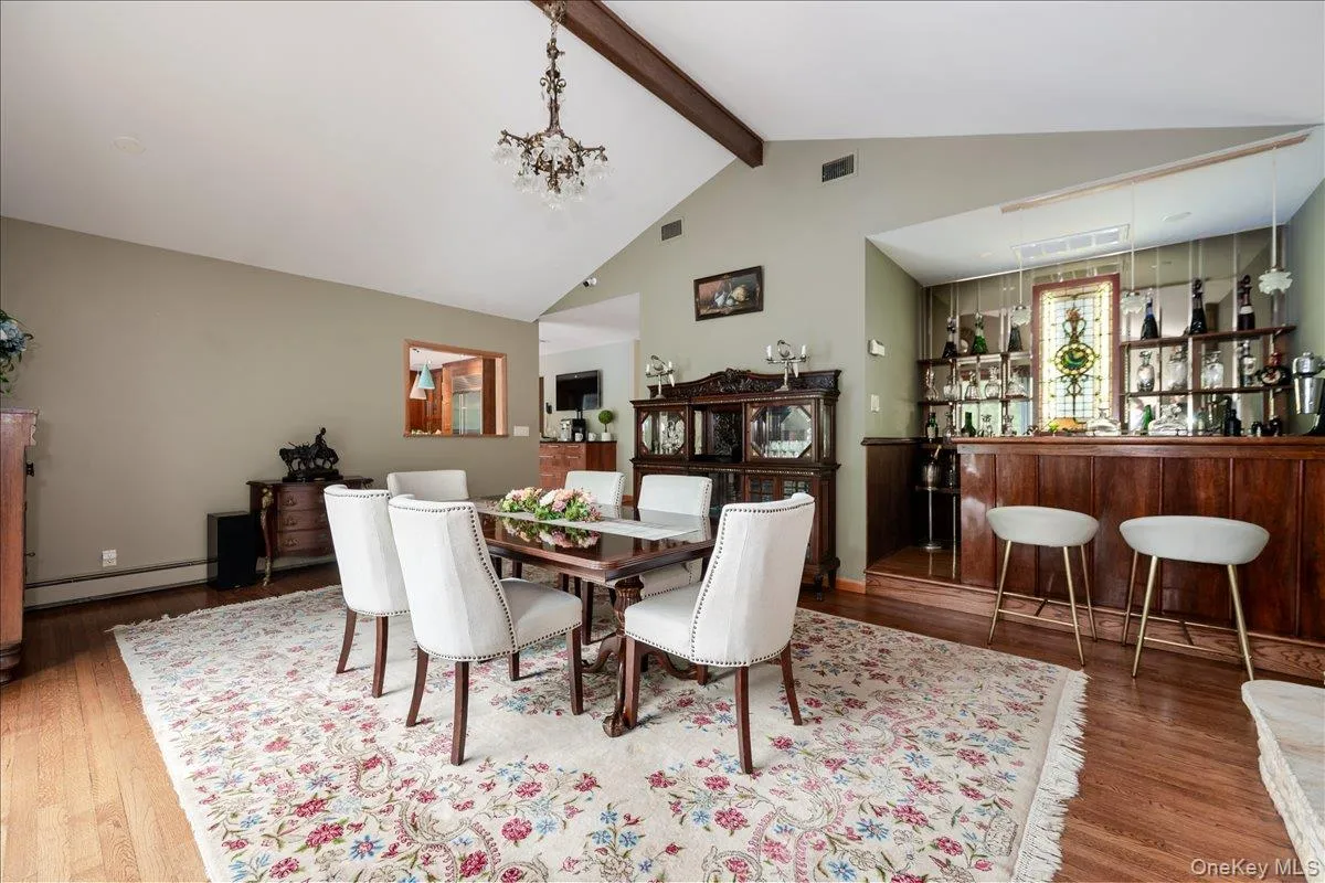 DR w/ wood burning fireplace, slider to deck, wet bar w/ wine fridge DR w/ wood burning fireplace, slider to deck, wet bar w/ wine fridge
