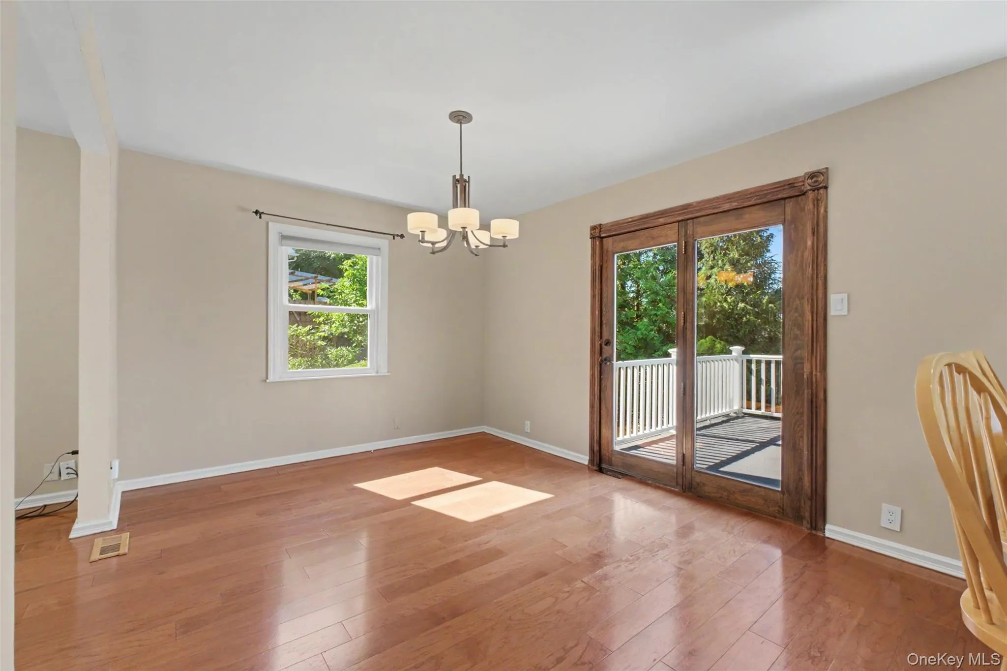 Dining room has slider to deck Dining room has slider to deck