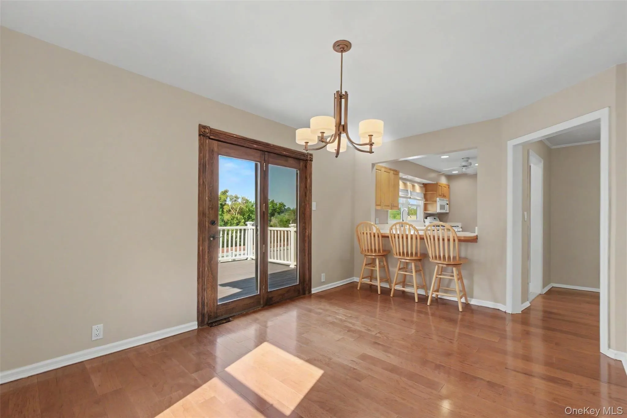 Dining room looking toward kitchen which has a breakfast bar Dining room looking toward kitchen which has a breakfast bar