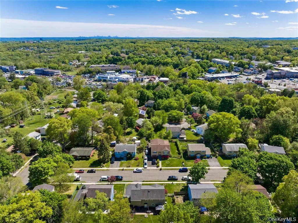 Residential neighborhood featuring mature trees and established homes Residential neighborhood featuring mature trees and established homes