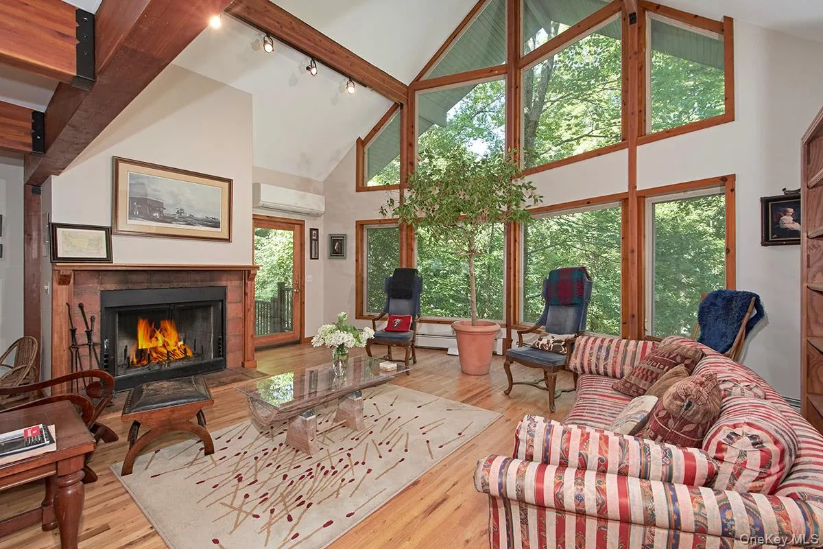 Living room with wood burning fireplace. Living room with wood burning fireplace.