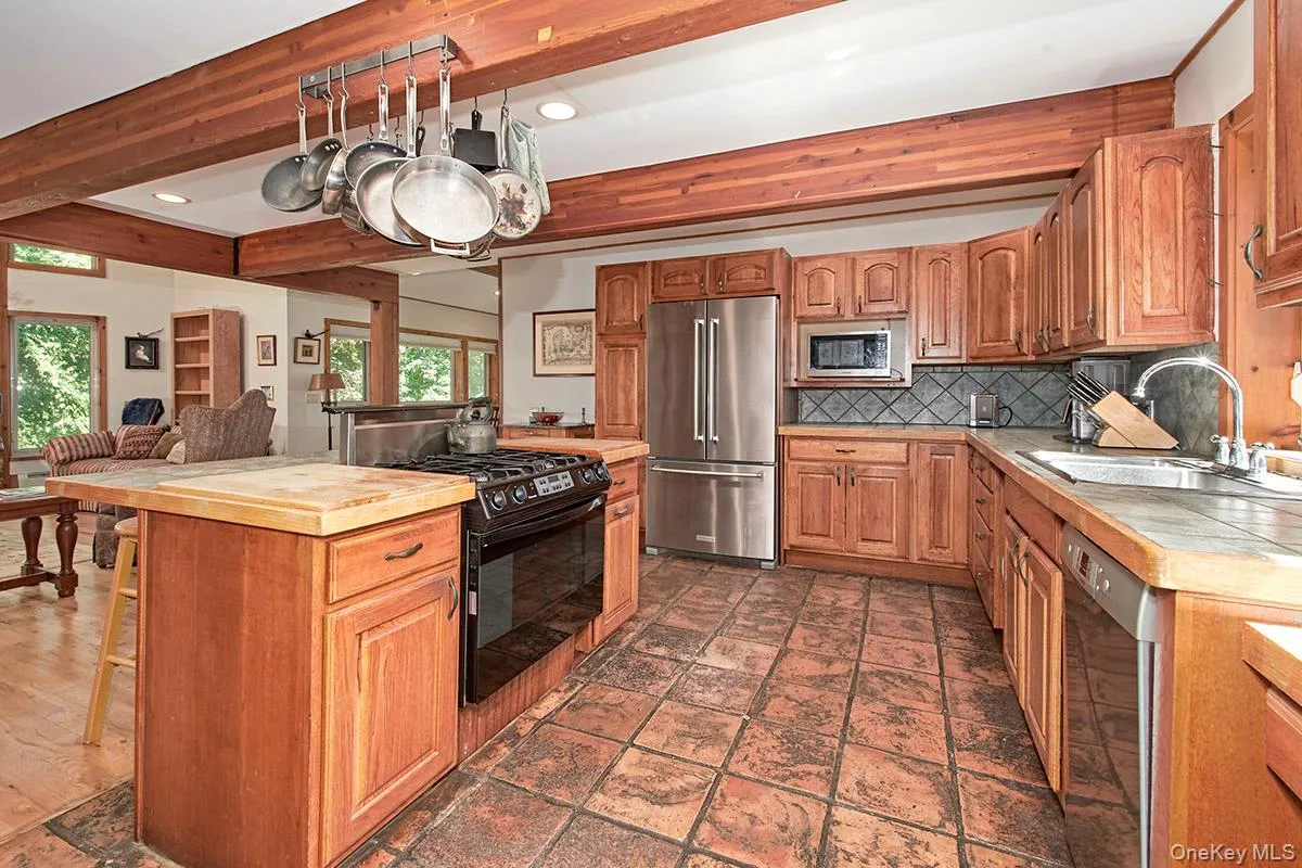 Another view of the kitchen, note the beautiful beams. Another view of the kitchen, note the beautiful beams.
