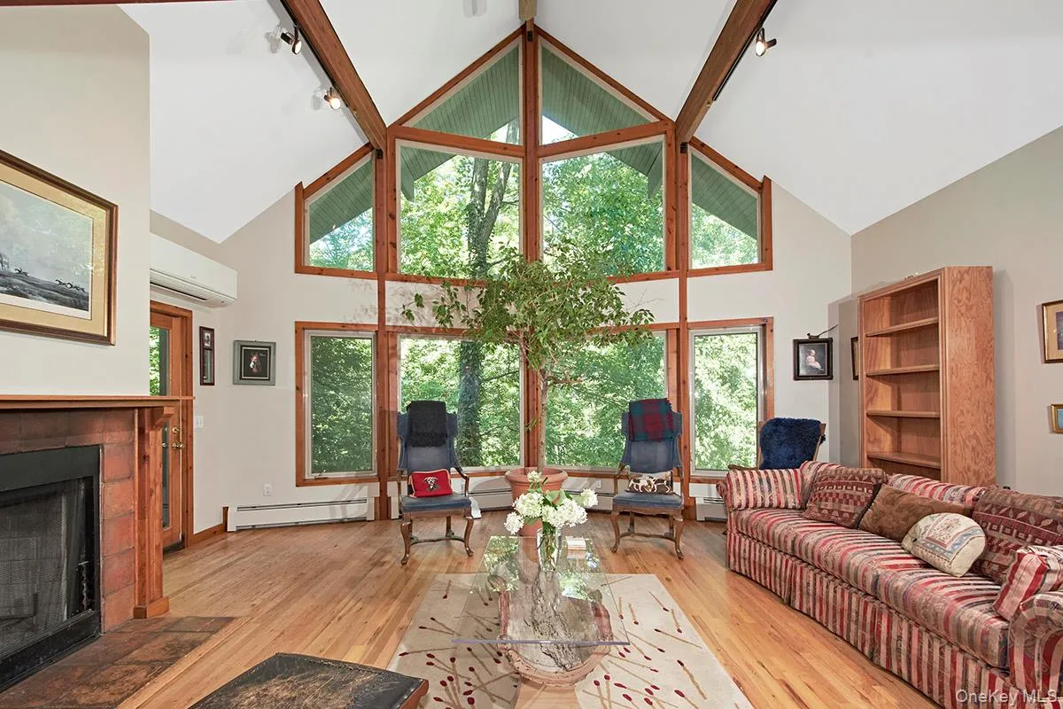 Wall of windows and hardwood floors. Wall of windows and hardwood floors.