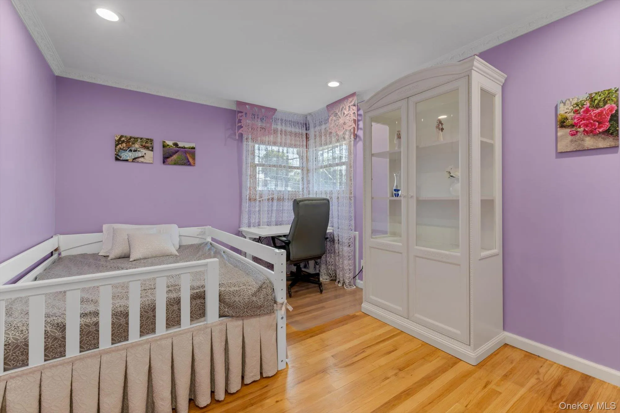 Bedroom with Hardwood flooring, recessed lighting, and crown molding Bedroom with Hardwood flooring, recessed lighting, and crown molding
