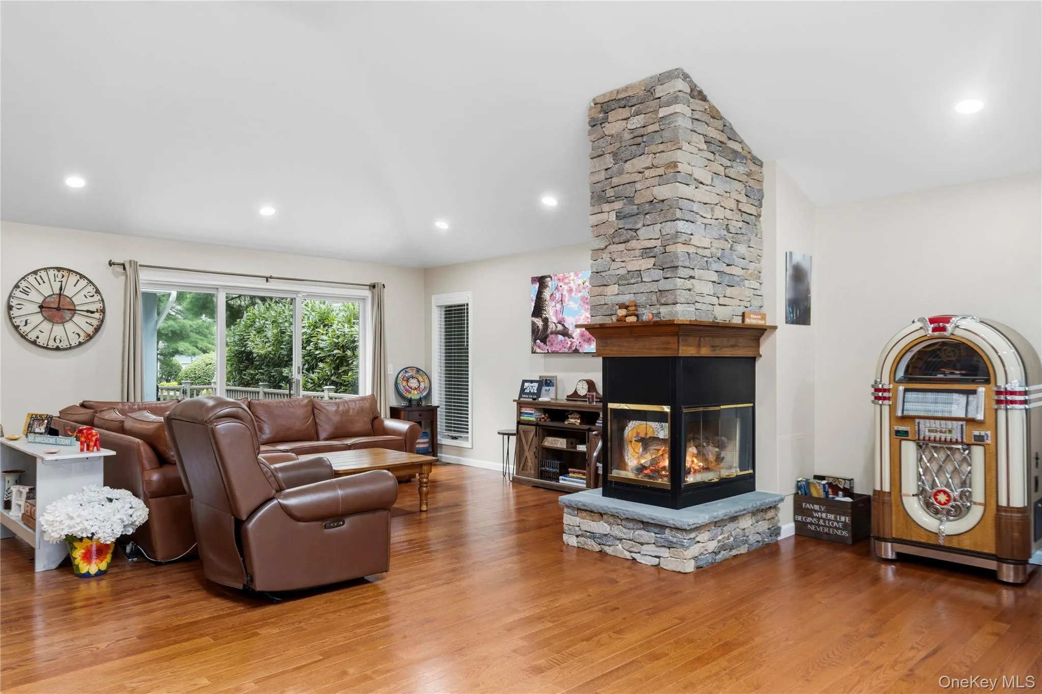 Gas Fireplace separates the family room and living room Gas Fireplace separates the family room and living room