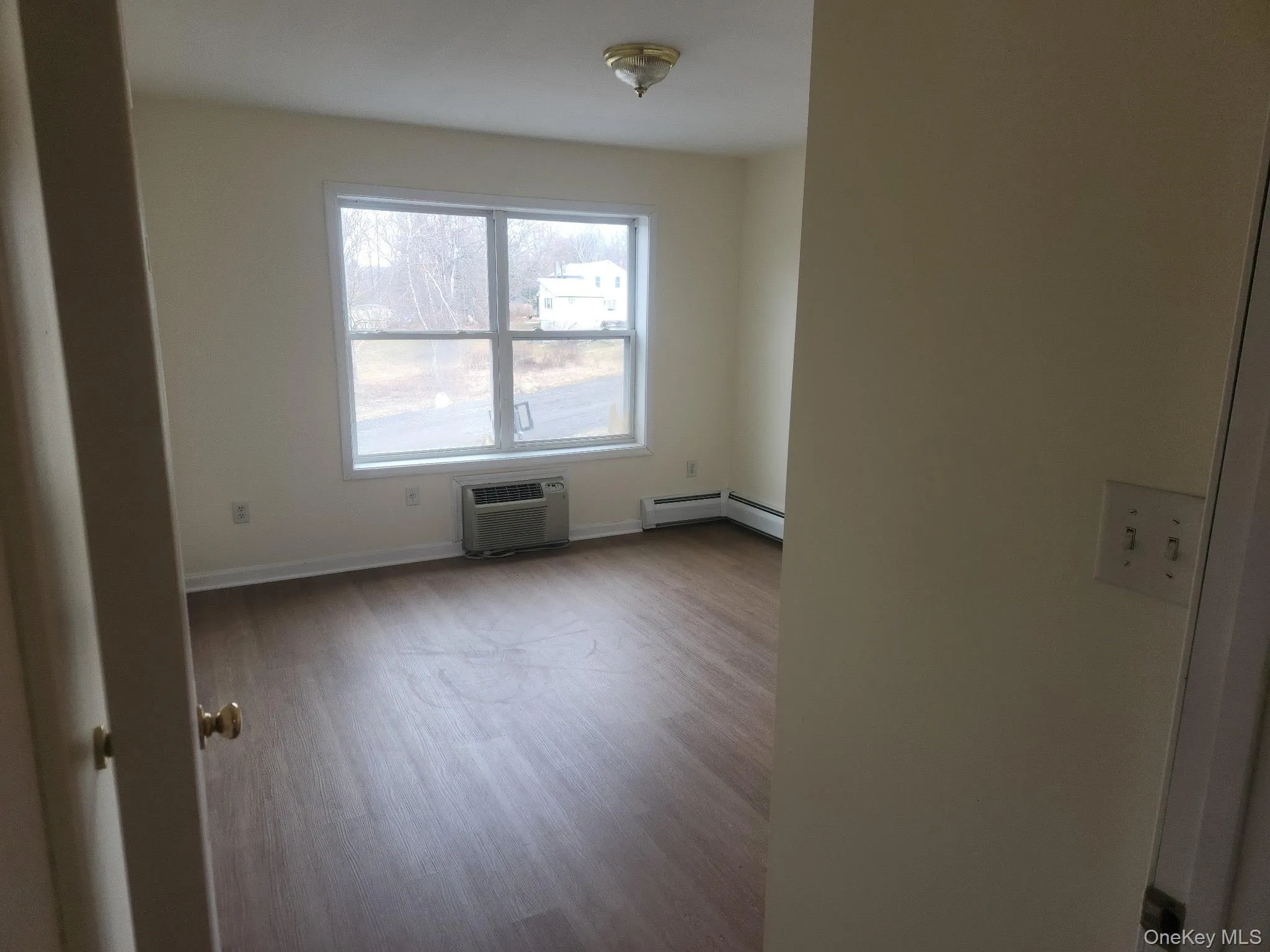 This bedroom faces the front parking and offers an A/C wall unit. This bedroom faces the front parking and offers an A/C wall unit.