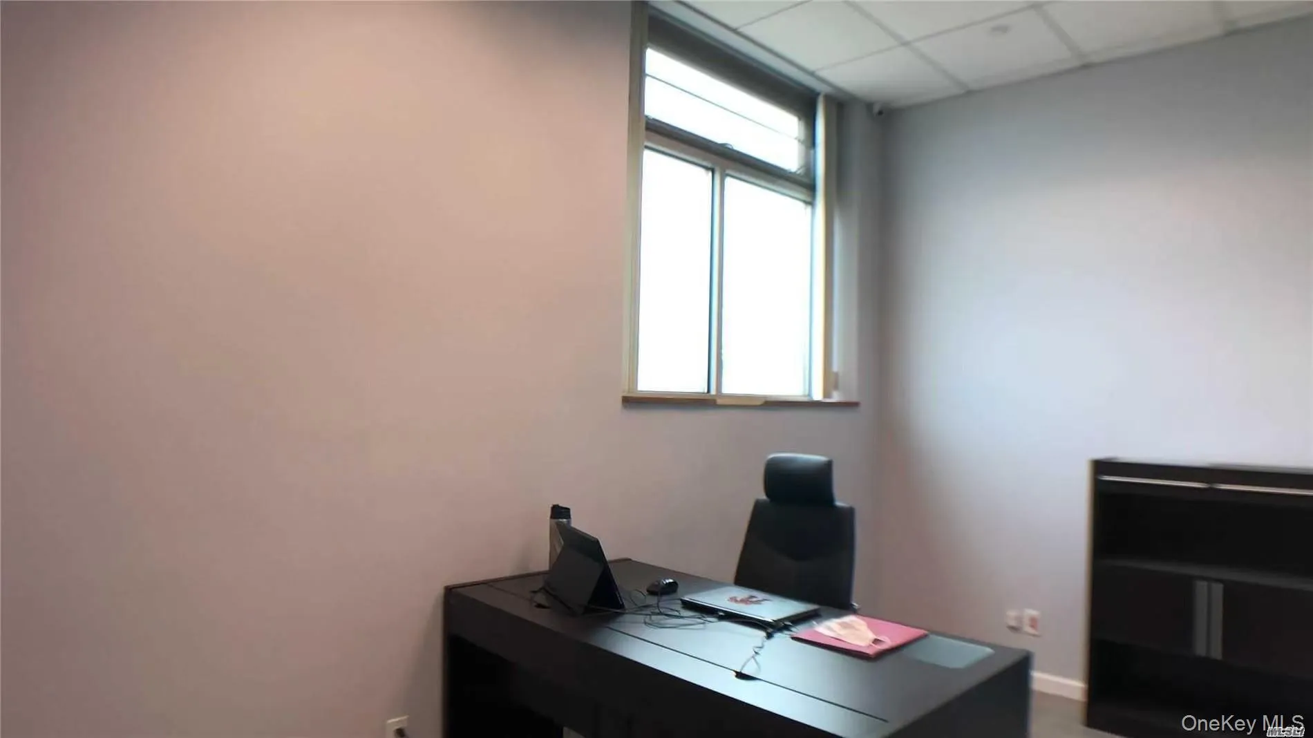 Office space featuring a paneled ceiling Office space featuring a paneled ceiling