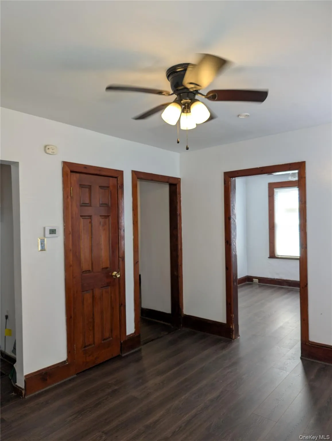 Formal dining room with entrance to living room, hallway and kitchen. Solid six panel wood door to closet Formal dining room with entrance to living room, hallway and kitchen. Solid six panel wood door to closet