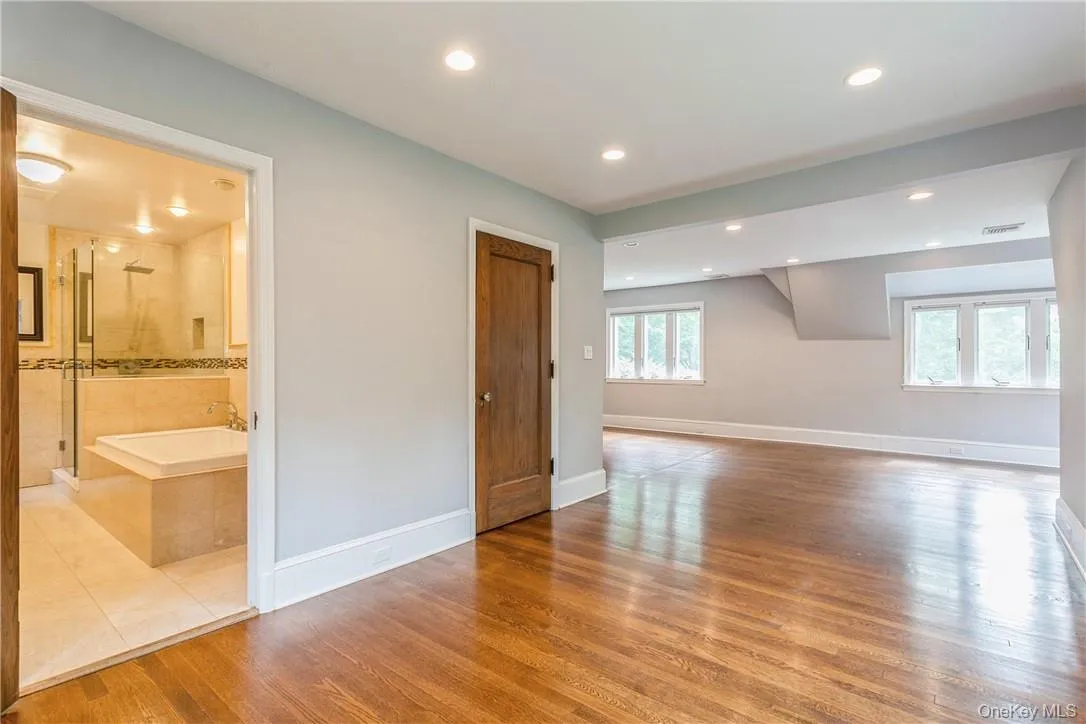 Primary bedroom with a walk-in closet and bath to the left. Primary bedroom with a walk-in closet and bath to the left.