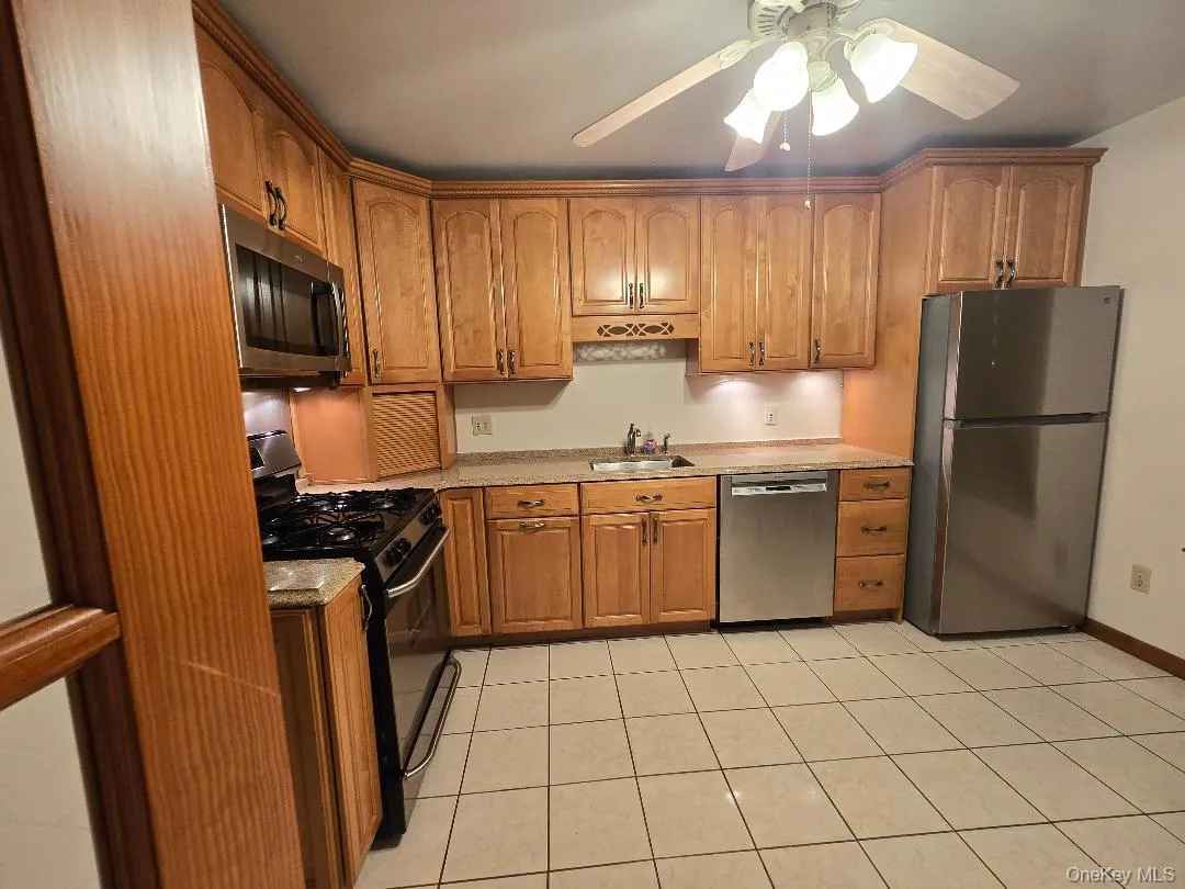 Huge, Eat-in-kitchen, featuring ceramic tiled flooring, Lots of solid wood Cabinetry, Stainless Steel Applicance (Gas Stove, DW, Brand-New Fridge), Granite Coutertops & Large Window! Huge, Eat-in-kitchen, featuring ceramic tiled flooring, Lots of solid wood Cabinetry, Stainless Steel Applicance (Gas Stove, DW, Brand-New Fridge), Granite Coutertops & Large Window!