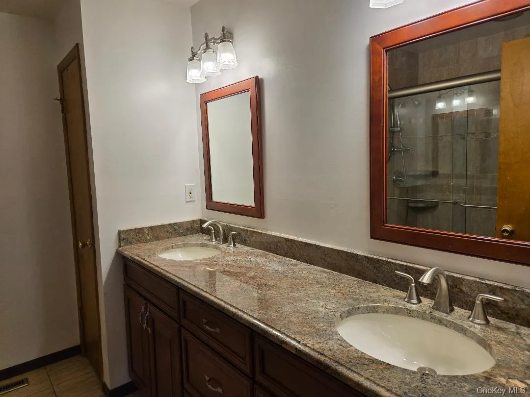 Here is another view of the extremely large and gorgeous double bowl vanity with Granite Top. Large linen closet is in the back right. Here is another view of the extremely large and gorgeous double bowl vanity with Granite Top. Large linen closet is in the back right.