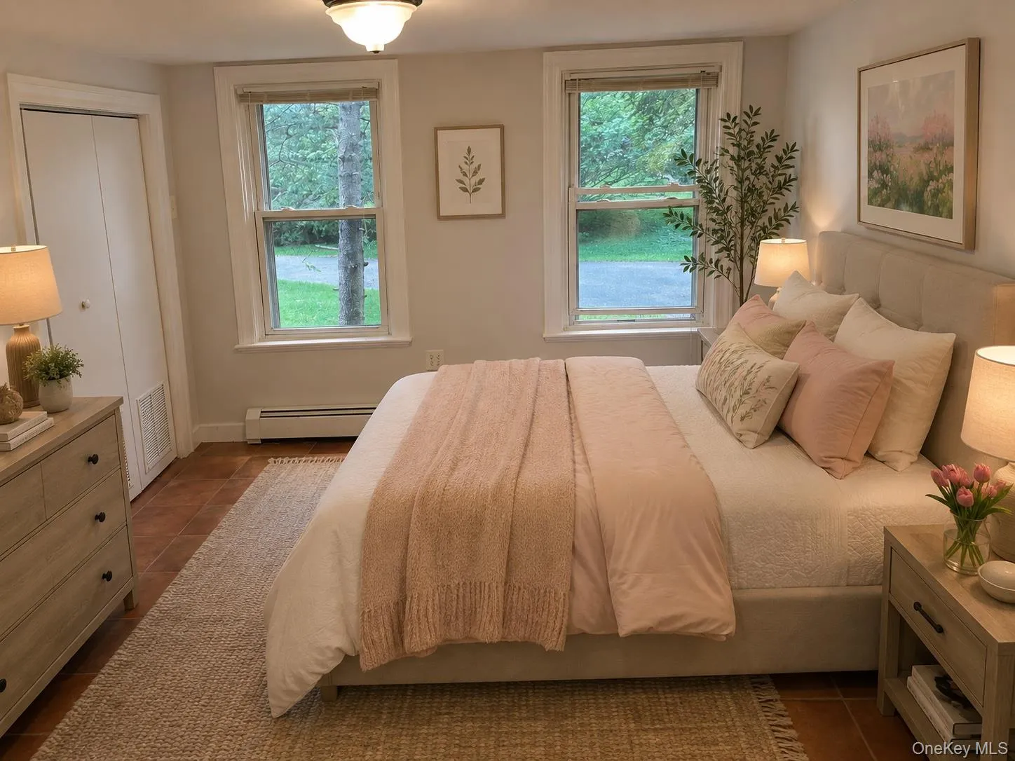 Primary bedroom staged, has 2 closets, terra cotta tiled floors. Virtually staged Primary bedroom staged, has 2 closets, terra cotta tiled floors. Virtually staged