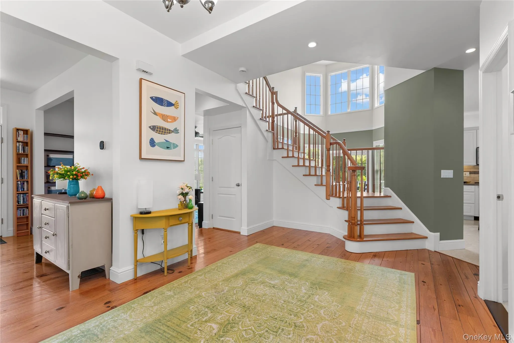 View of the entry way facing built in wooden staircase View of the entry way facing built in wooden staircase