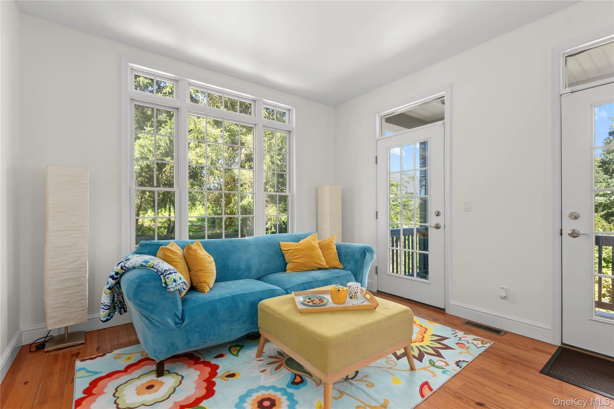 Hardwood floors and door leading to balcony. Hardwood floors and door leading to balcony.