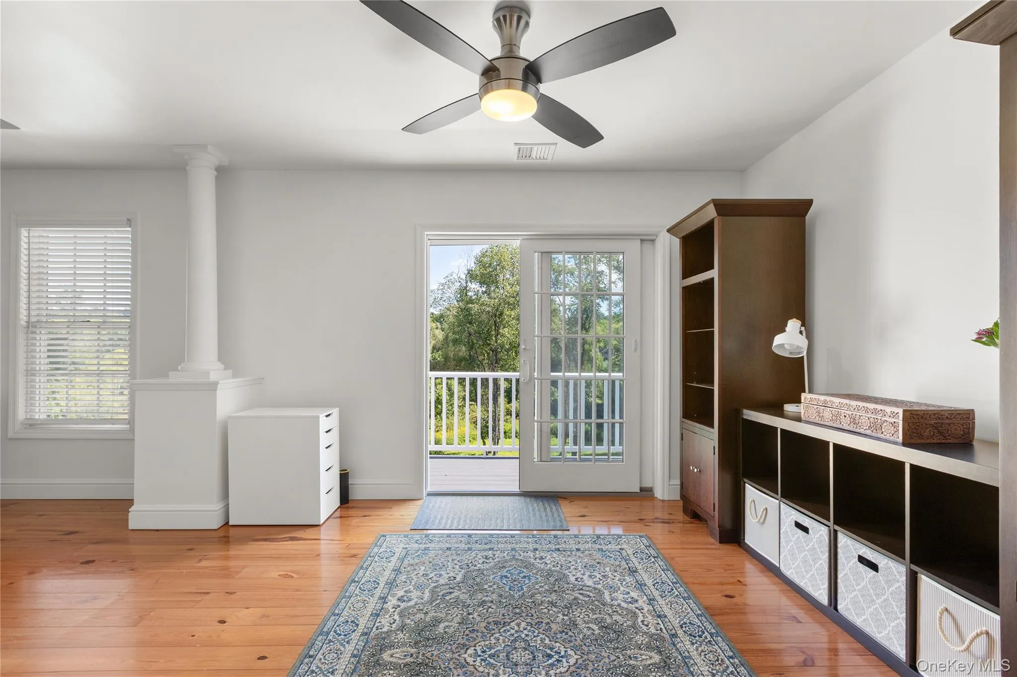 Spacious sitting part of the primary bedroom hardwood flooring and balcony Spacious sitting part of the primary bedroom hardwood flooring and balcony
