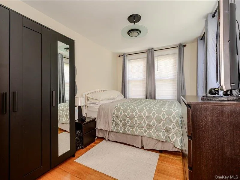 Bedroom # 3 Warm wood flooring complementing a crisp white wall palette Bedroom # 3 Warm wood flooring complementing a crisp white wall palette
