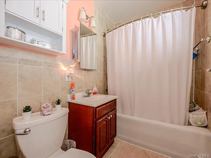 2nd Floor Full bathroom featuring a single vanity, a tiled shower/tub combination, and a white toilet 2nd Floor Full bathroom featuring a single vanity, a tiled shower/tub combination, and a white toilet