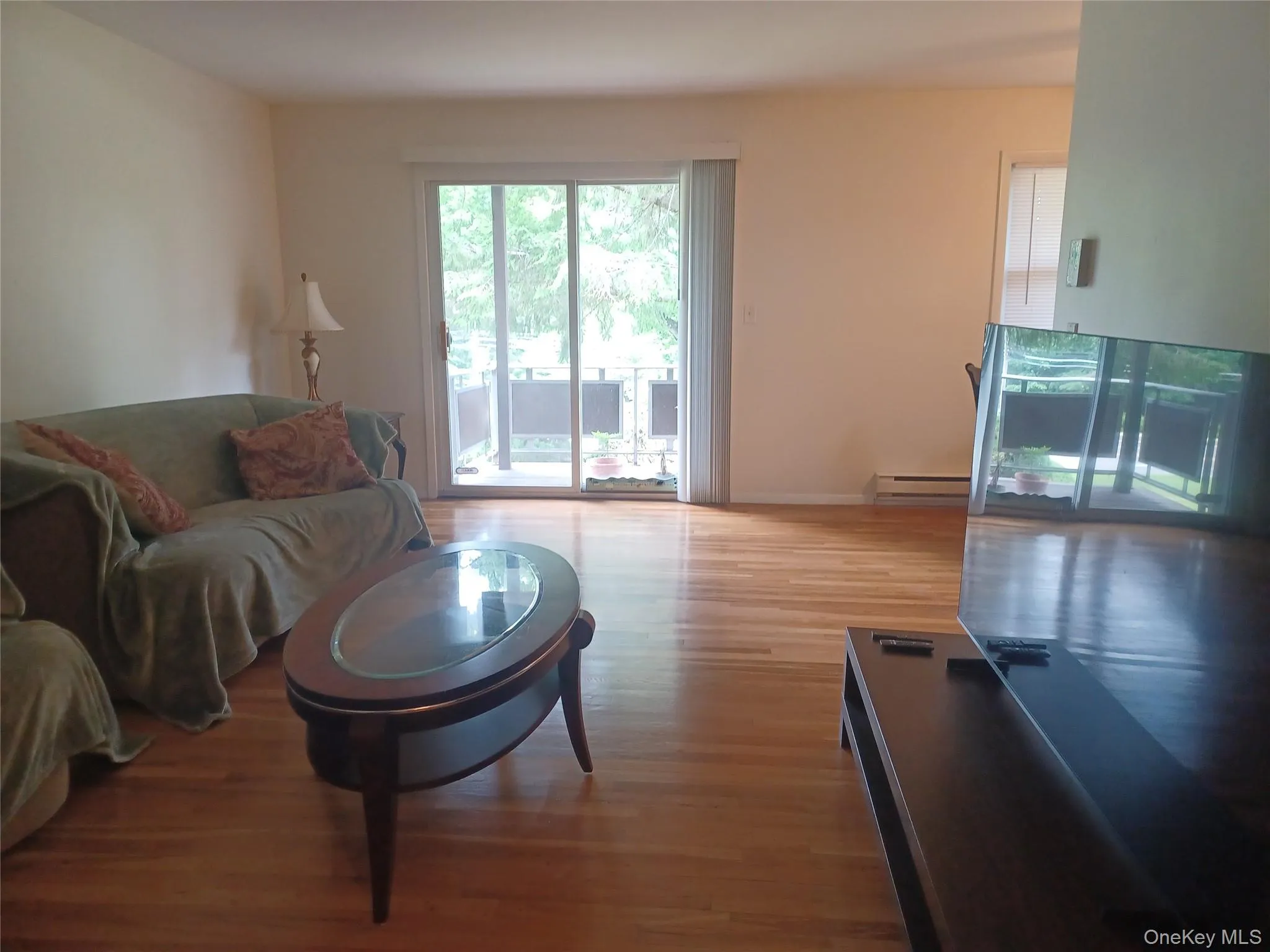 Hardwood Floors. Sliders to deck Hardwood Floors. Sliders to deck