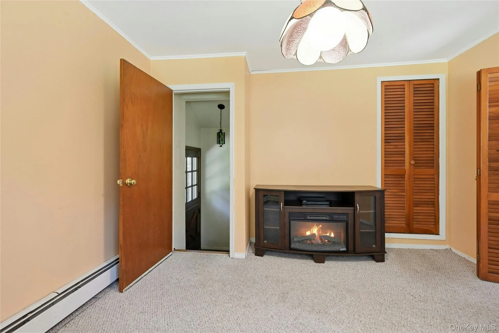 View from den to side yard door and basement entry View from den to side yard door and basement entry