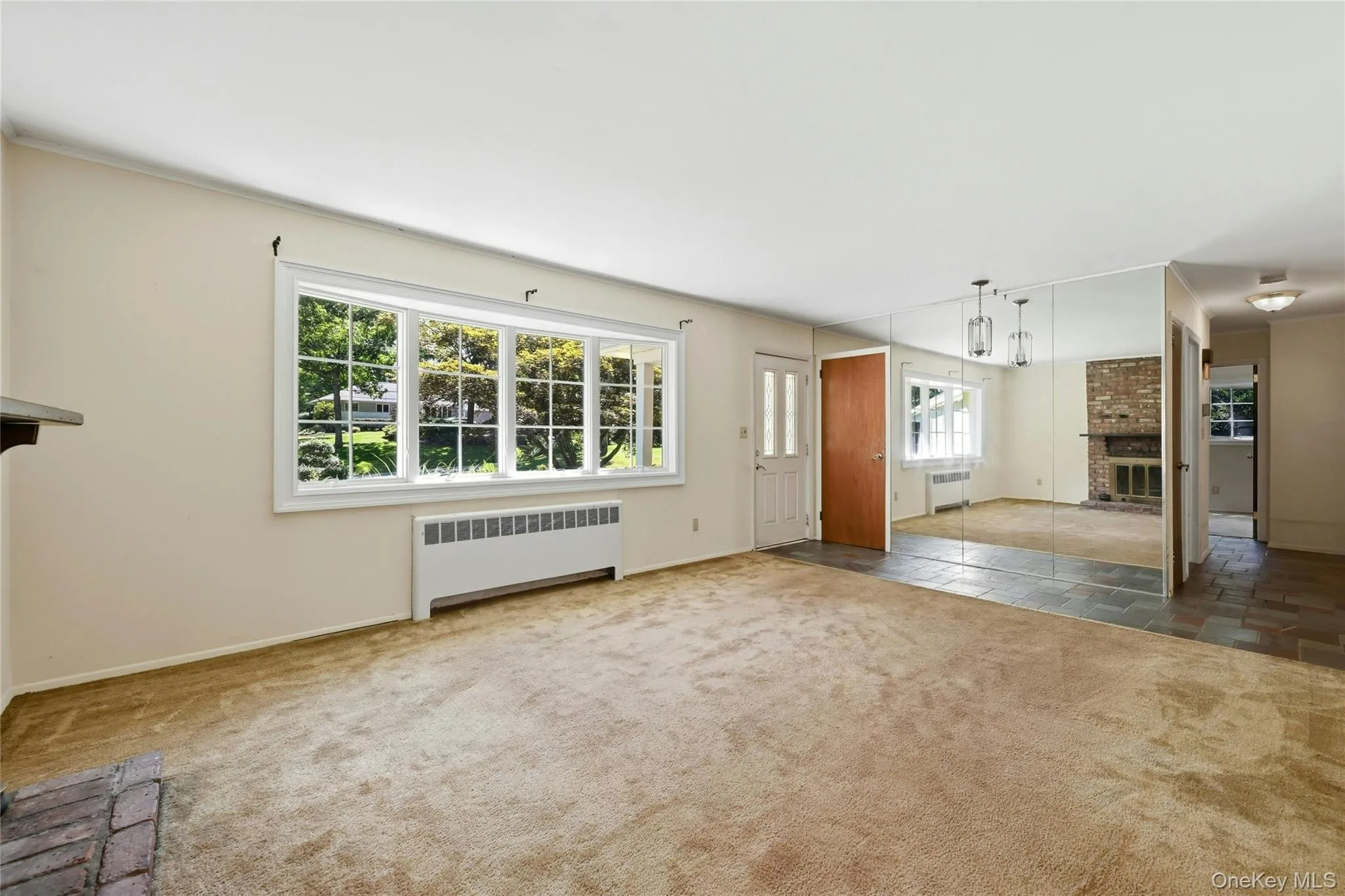Living room with view to the front entry and hallway to bedrooms Living room with view to the front entry and hallway to bedrooms