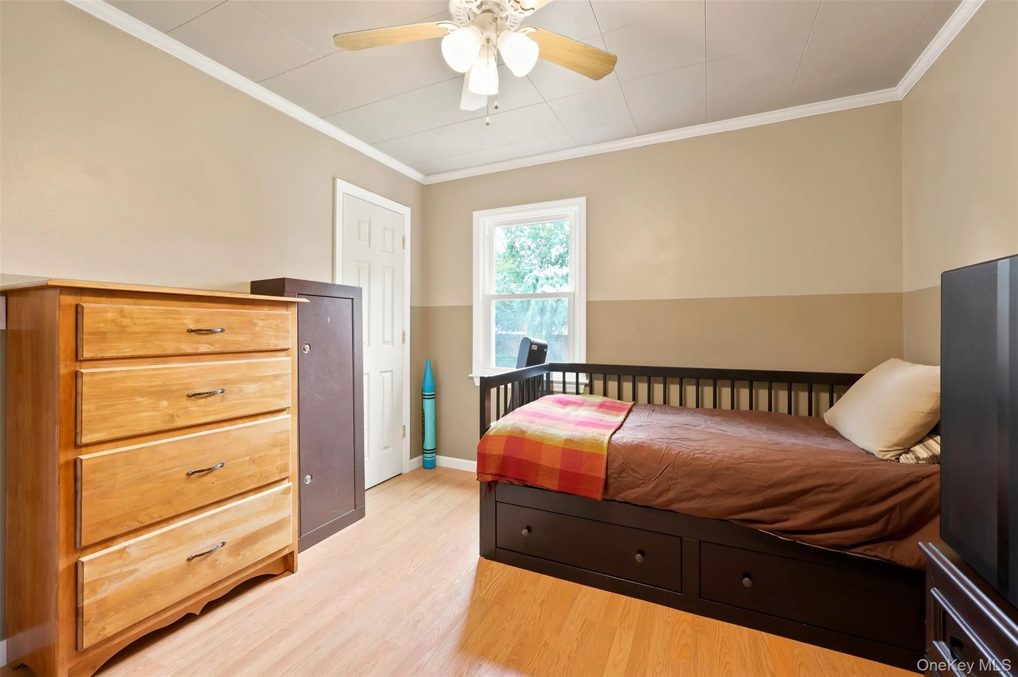 Light wood-finish flooring complements the neutral two-tone wall paint Light wood-finish flooring complements the neutral two-tone wall paint
