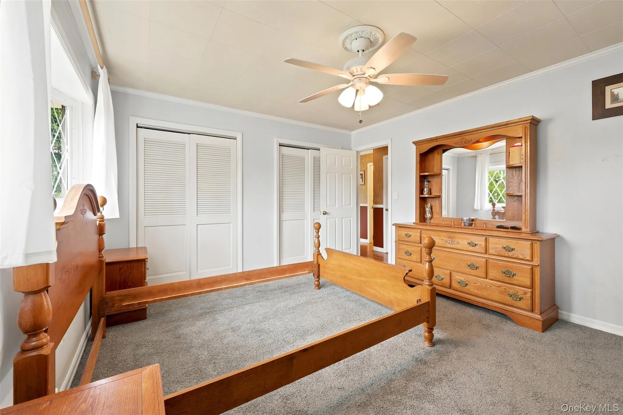 Light gray wall paint, textured ceiling, and gray carpeting Light gray wall paint, textured ceiling, and gray carpeting