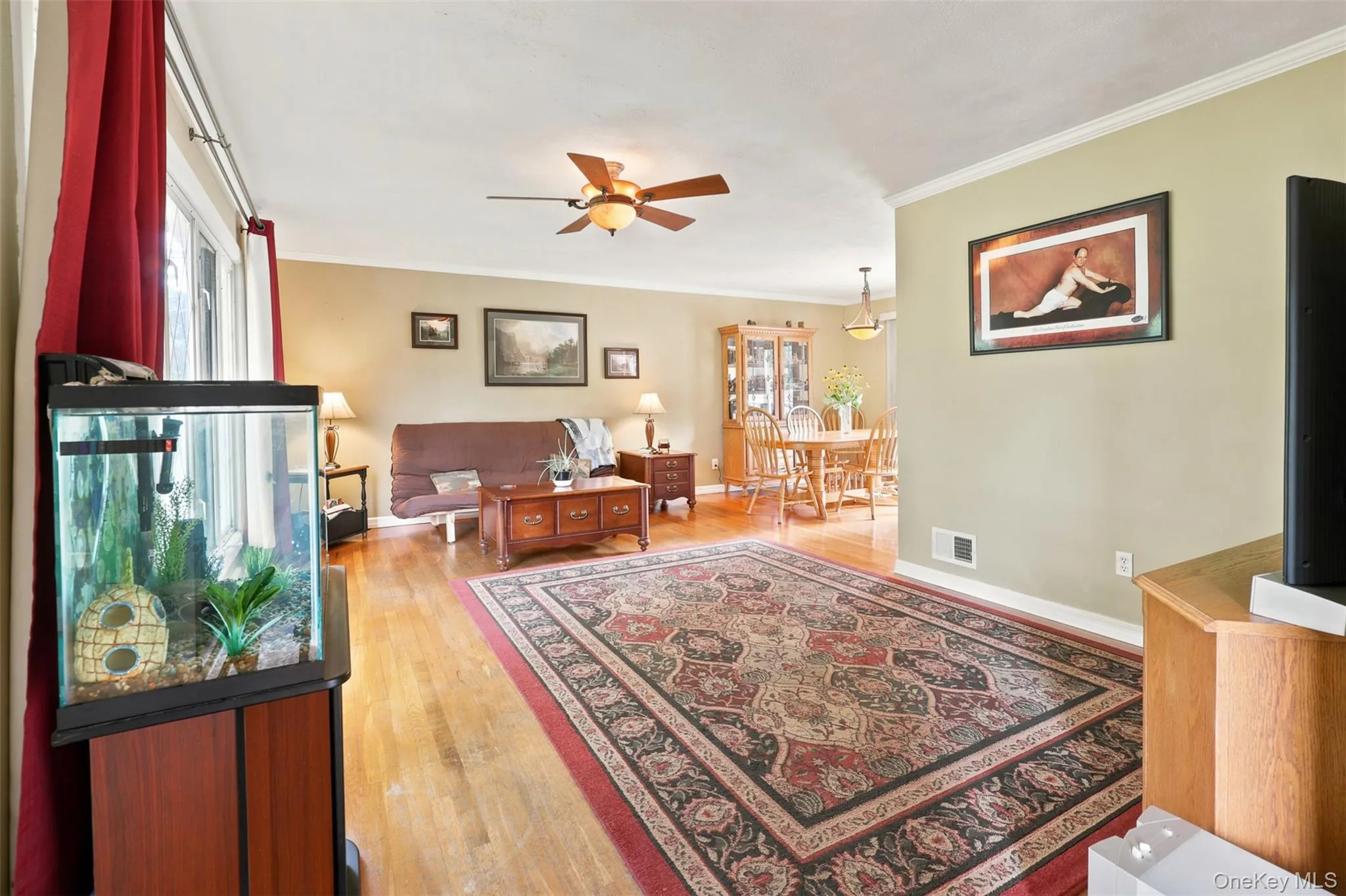 Hardwood-style flooring throughout, complemented by a ceiling fan with integrated lighting Hardwood-style flooring throughout, complemented by a ceiling fan with integrated lighting