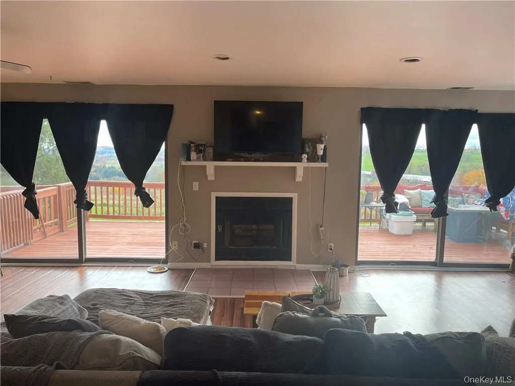 Living Room w/Fireplace Sliders going to Deck Living Room w/Fireplace Sliders going to Deck