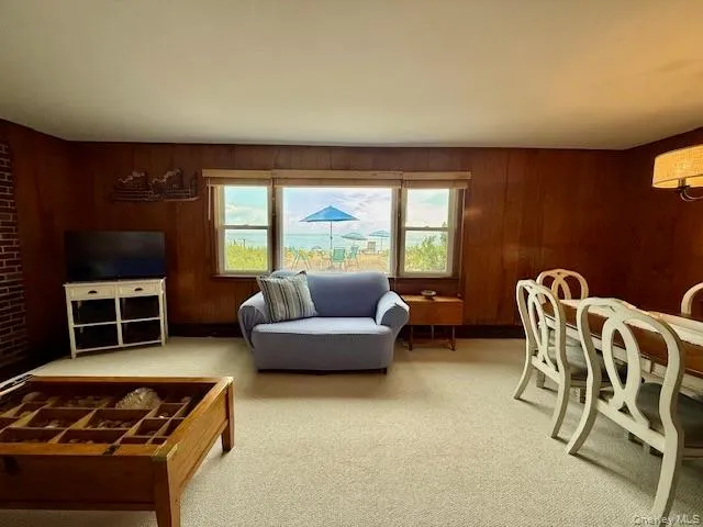 Living Room/Dining Area with Views of the Long Island Sound. Living Room/Dining Area with Views of the Long Island Sound.