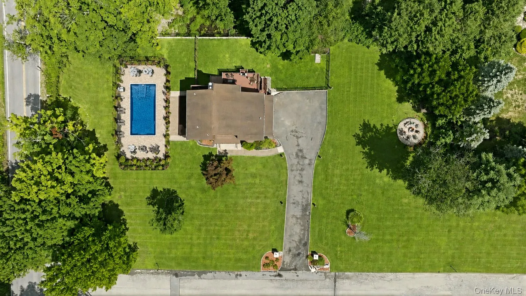 Aerial view showcasing a virtually staged large pool and patio. Massive yard can be a new owners playground and sactuary! Aerial view showcasing a virtually staged large pool and patio. Massive yard can be a new owners playground and sactuary!