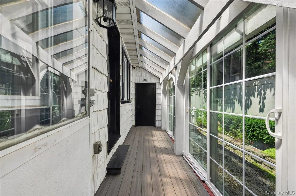 Covered walkway from garage to the house from the back Covered walkway from garage to the house from the back