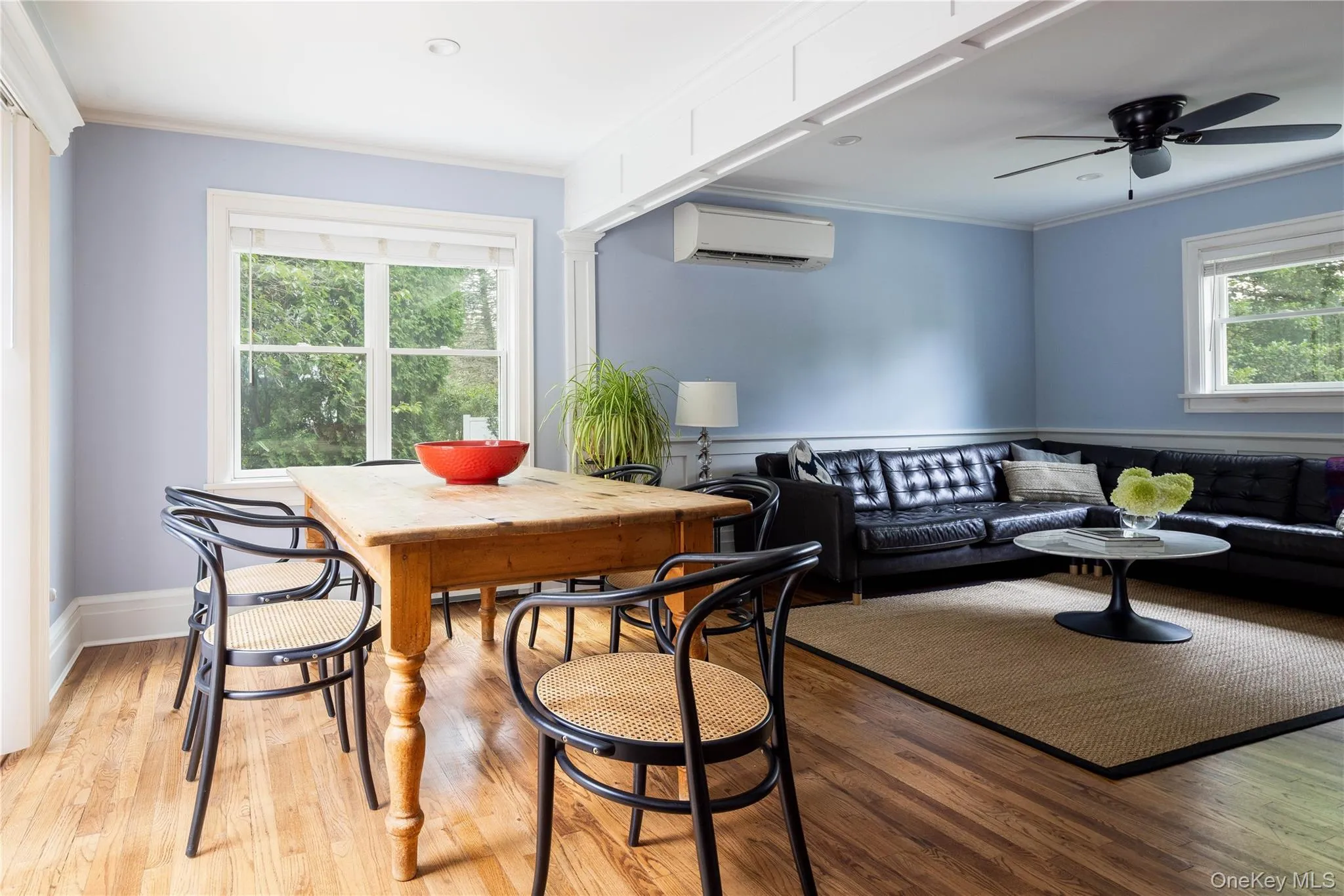 Main dining area leading into living room with ceiling fan Main dining area leading into living room with ceiling fan