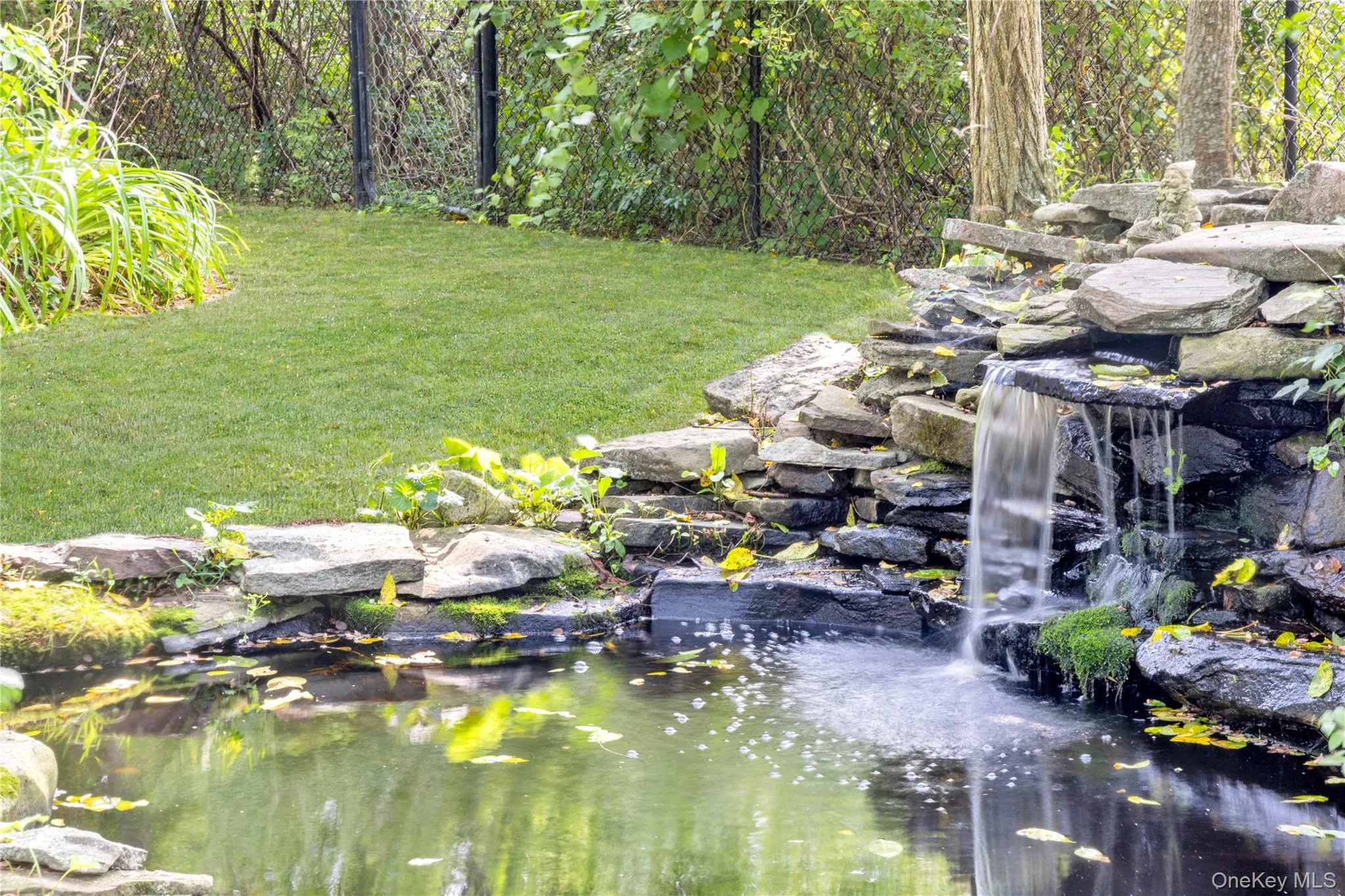 Koi pond with waterfall Koi pond with waterfall