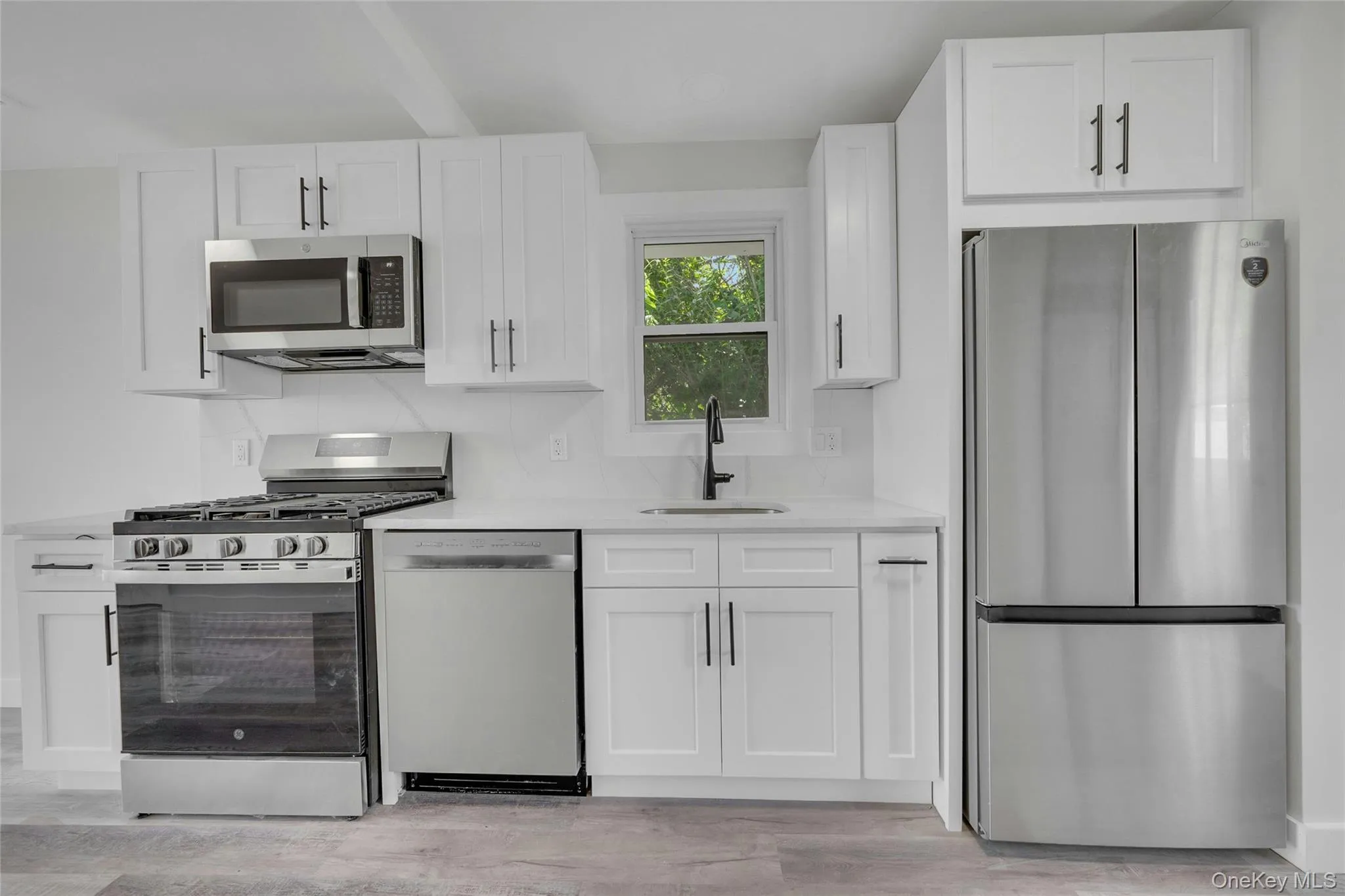 Brand new kitchen with stainless appliances and beautiful white cabinetry with plenty of storage Brand new kitchen with stainless appliances and beautiful white cabinetry with plenty of storage
