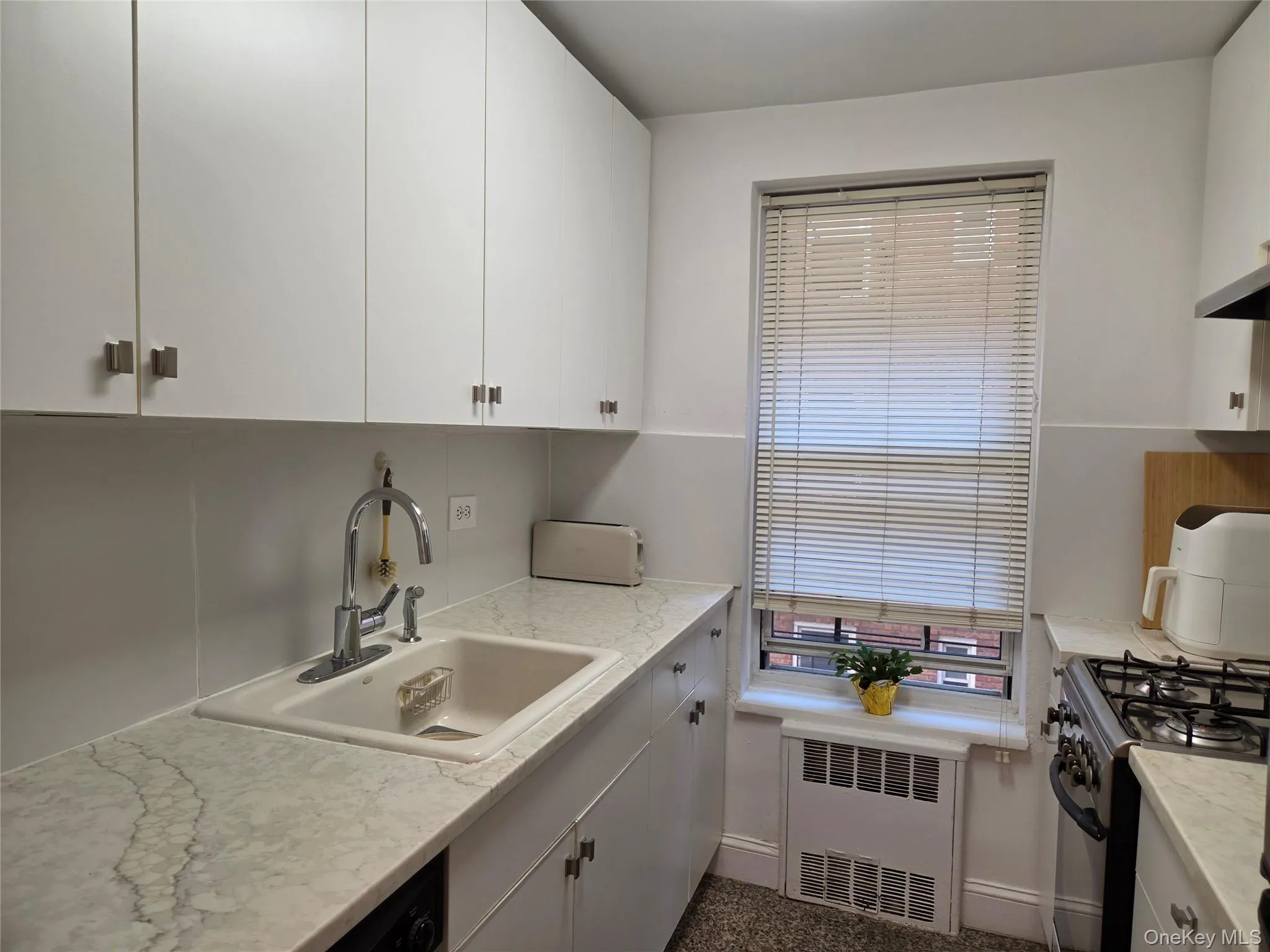 Updated kitchen with stainless dishwasher, range and refrigerator Updated kitchen with stainless dishwasher, range and refrigerator