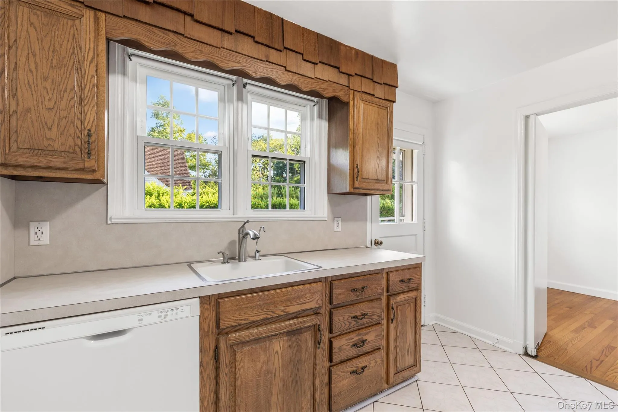kitchen with door out to patio and yard kitchen with door out to patio and yard
