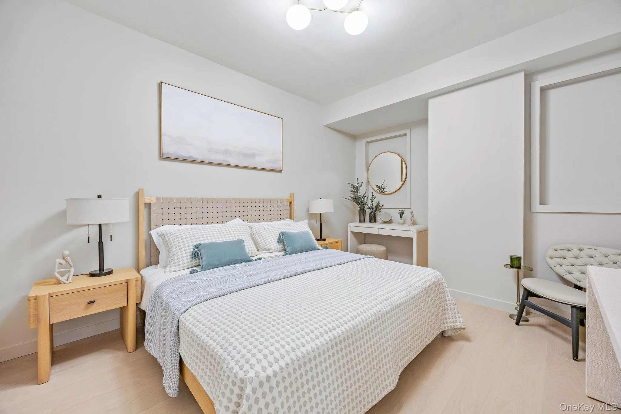 Bedroom with light wood finished floors and baseboards Bedroom with light wood finished floors and baseboards