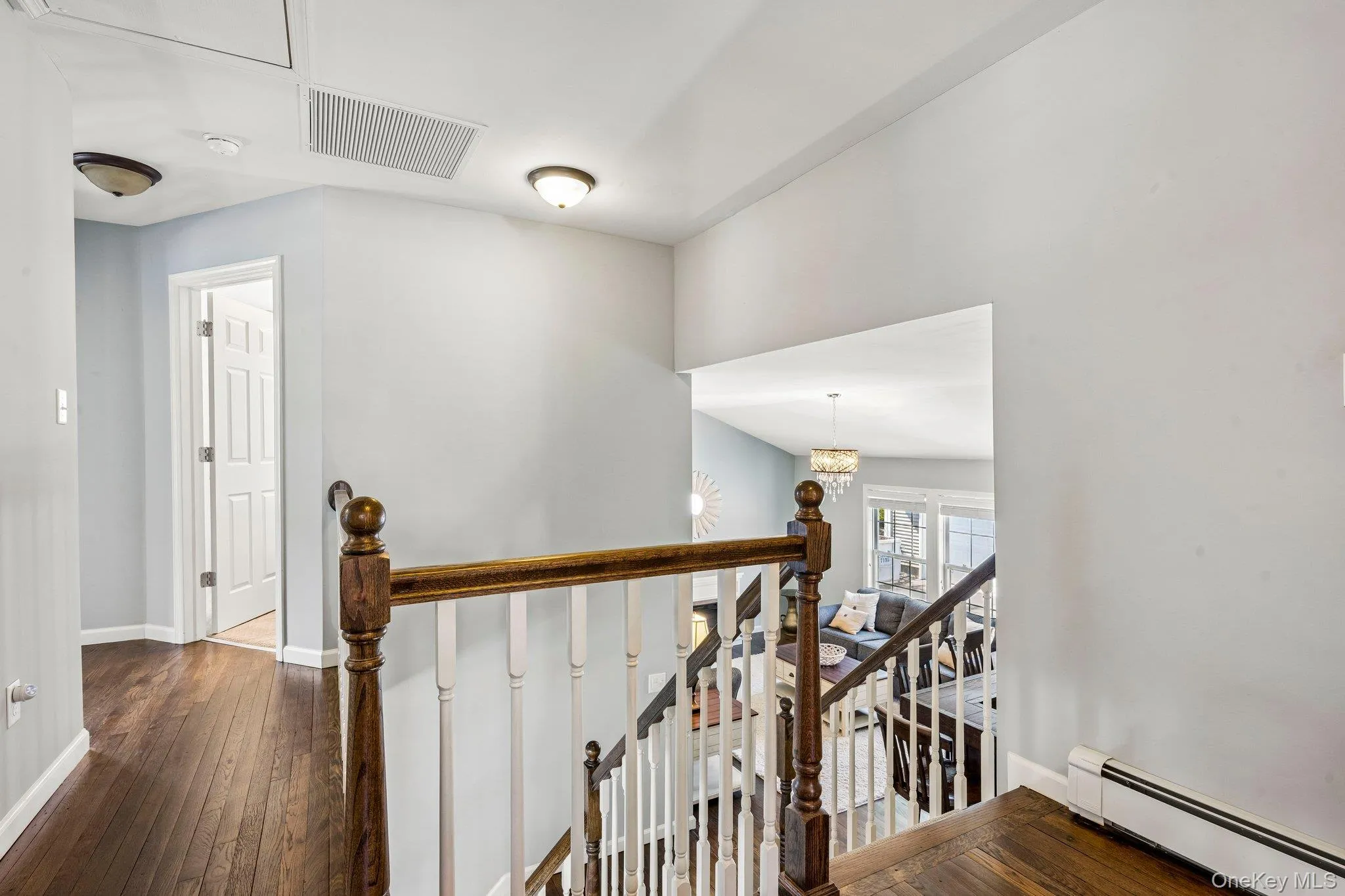 2nd Floor Landing with Banister Open to Living Room 2nd Floor Landing with Banister Open to Living Room