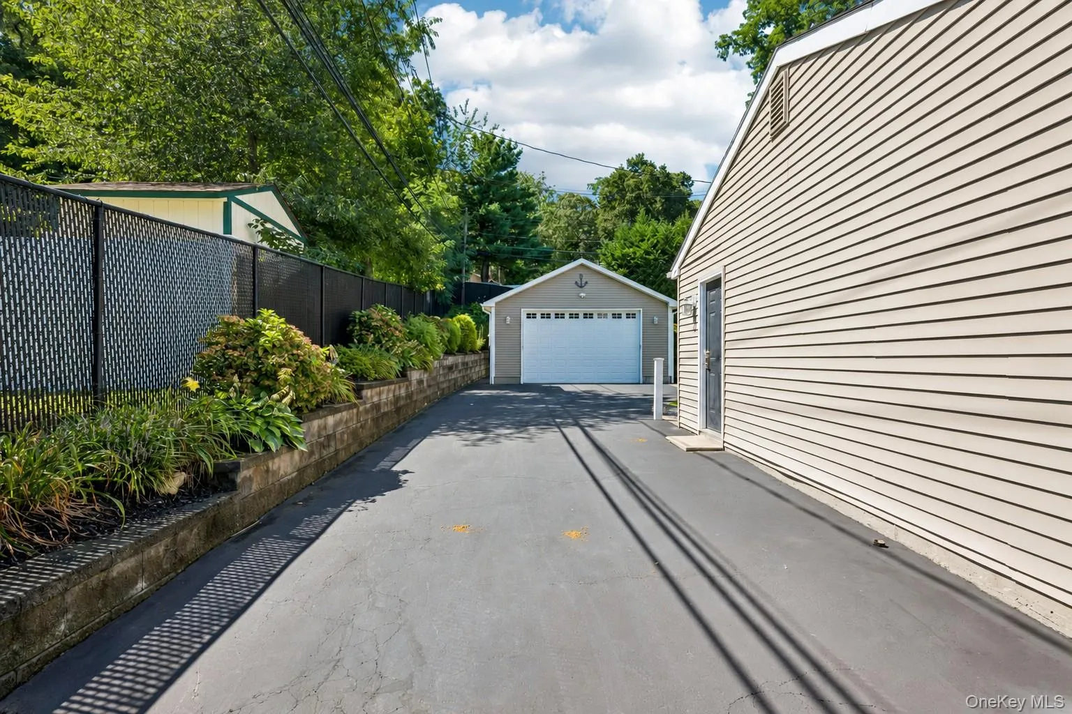 Extended Driveway Leading to 2+ Car Detached Garage Extended Driveway Leading to 2+ Car Detached Garage