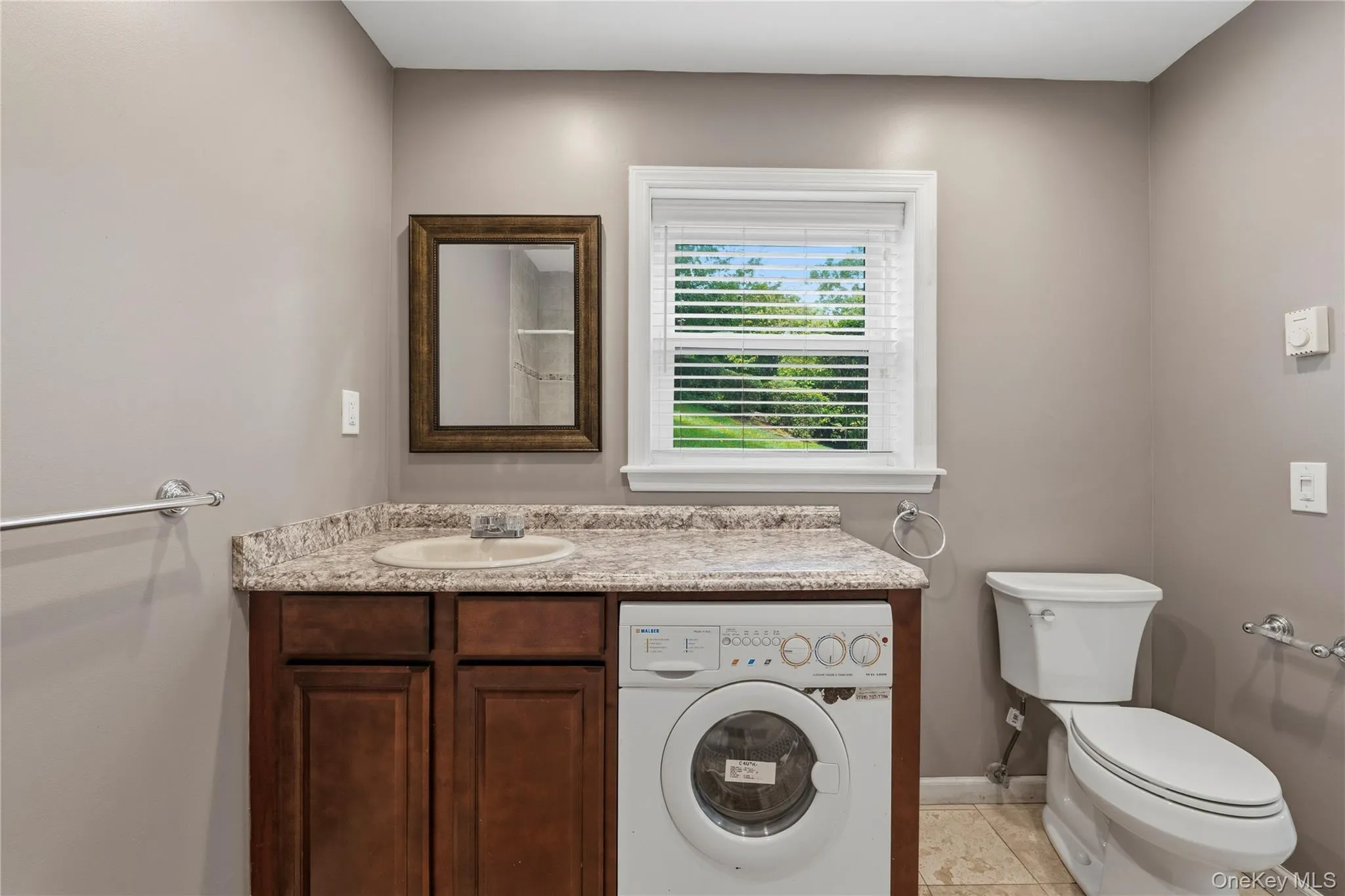 Window in bathroom for natural light & ventilation, lovely vanity and matching countertop. Window in bathroom for natural light & ventilation, lovely vanity and matching countertop.