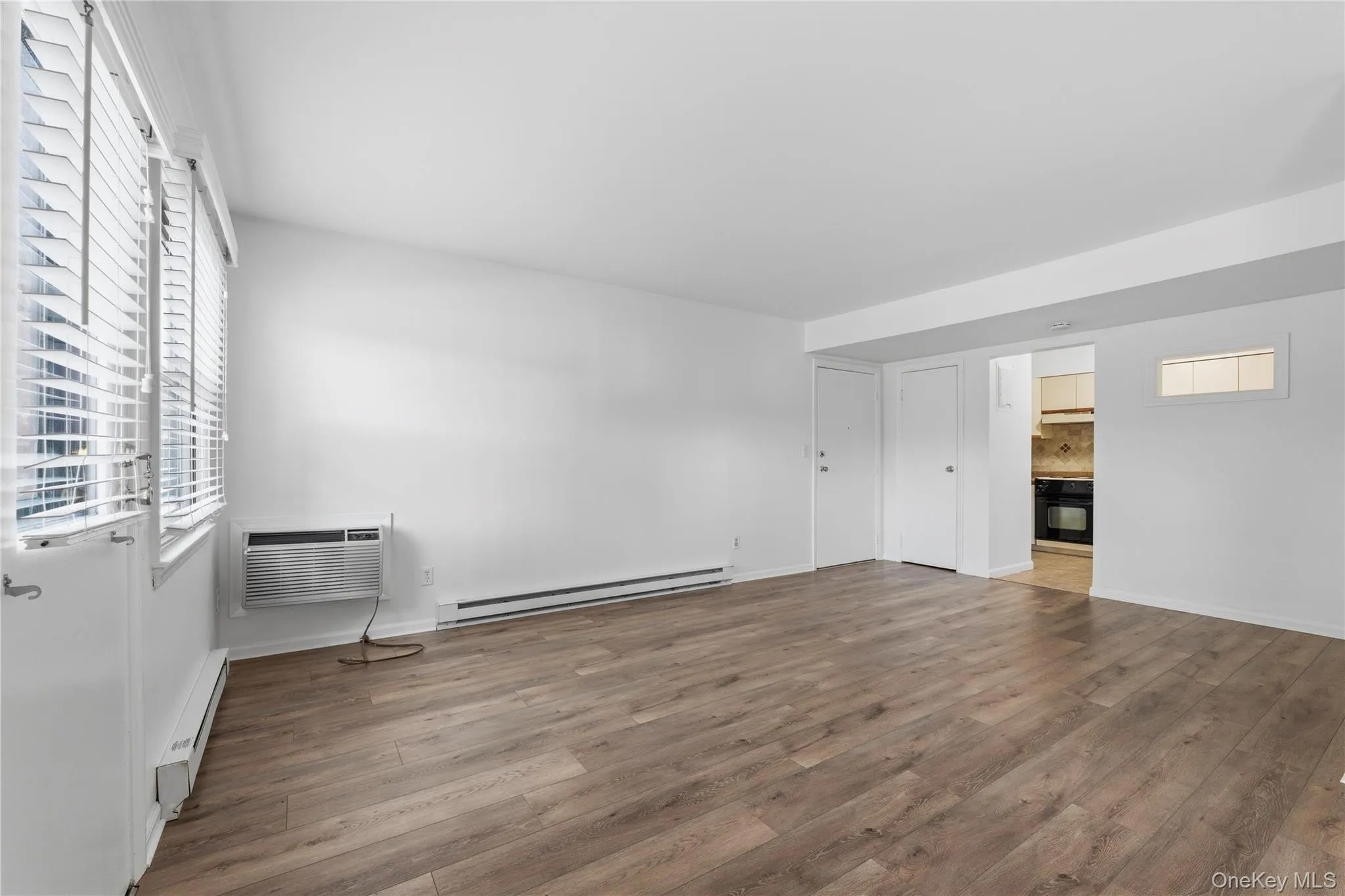 View from opposite side with kitchen and living area. View from opposite side with kitchen and living area.