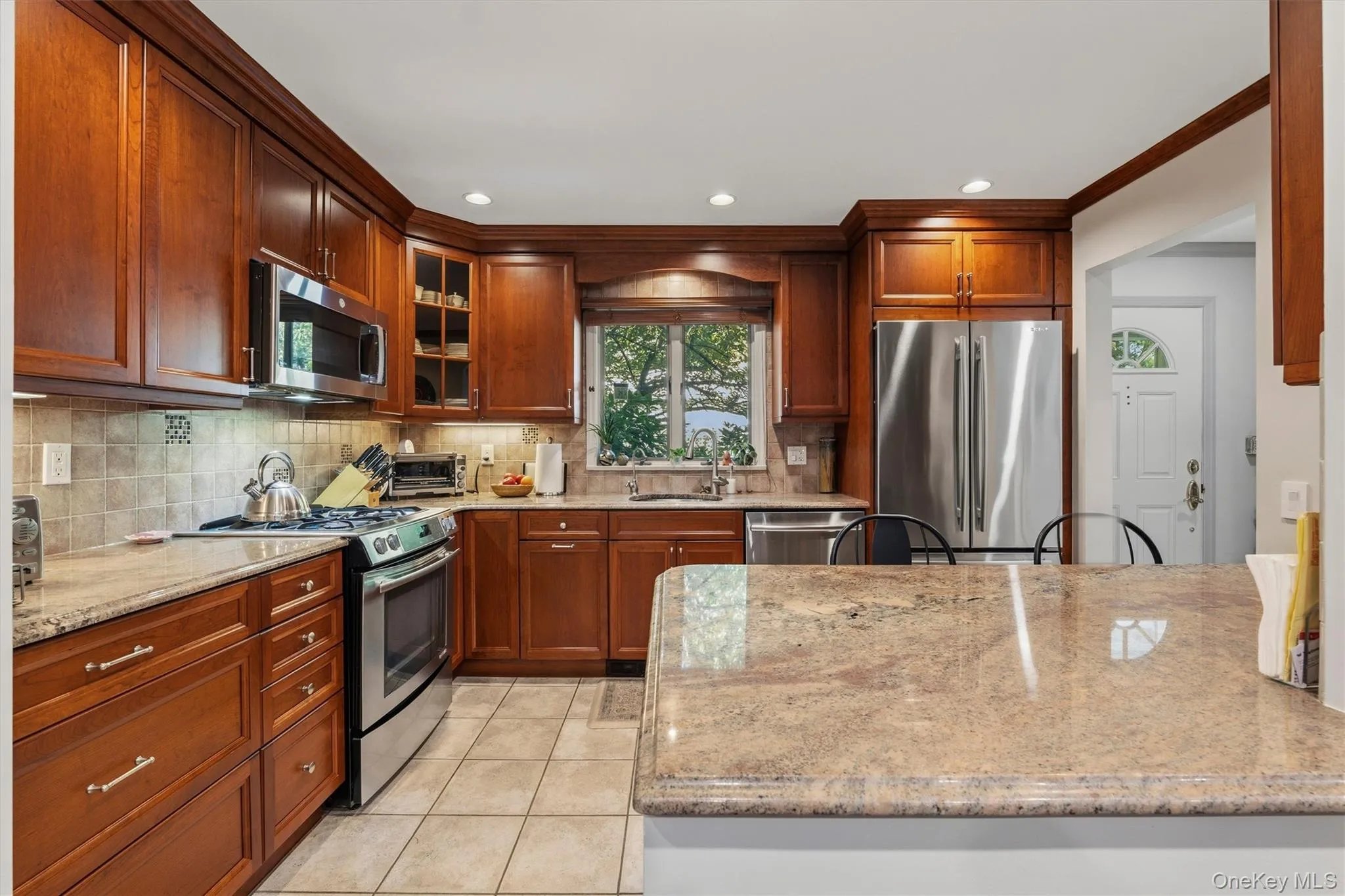 Stainless steel appliance and granite counters in kitchen Stainless steel appliance and granite counters in kitchen