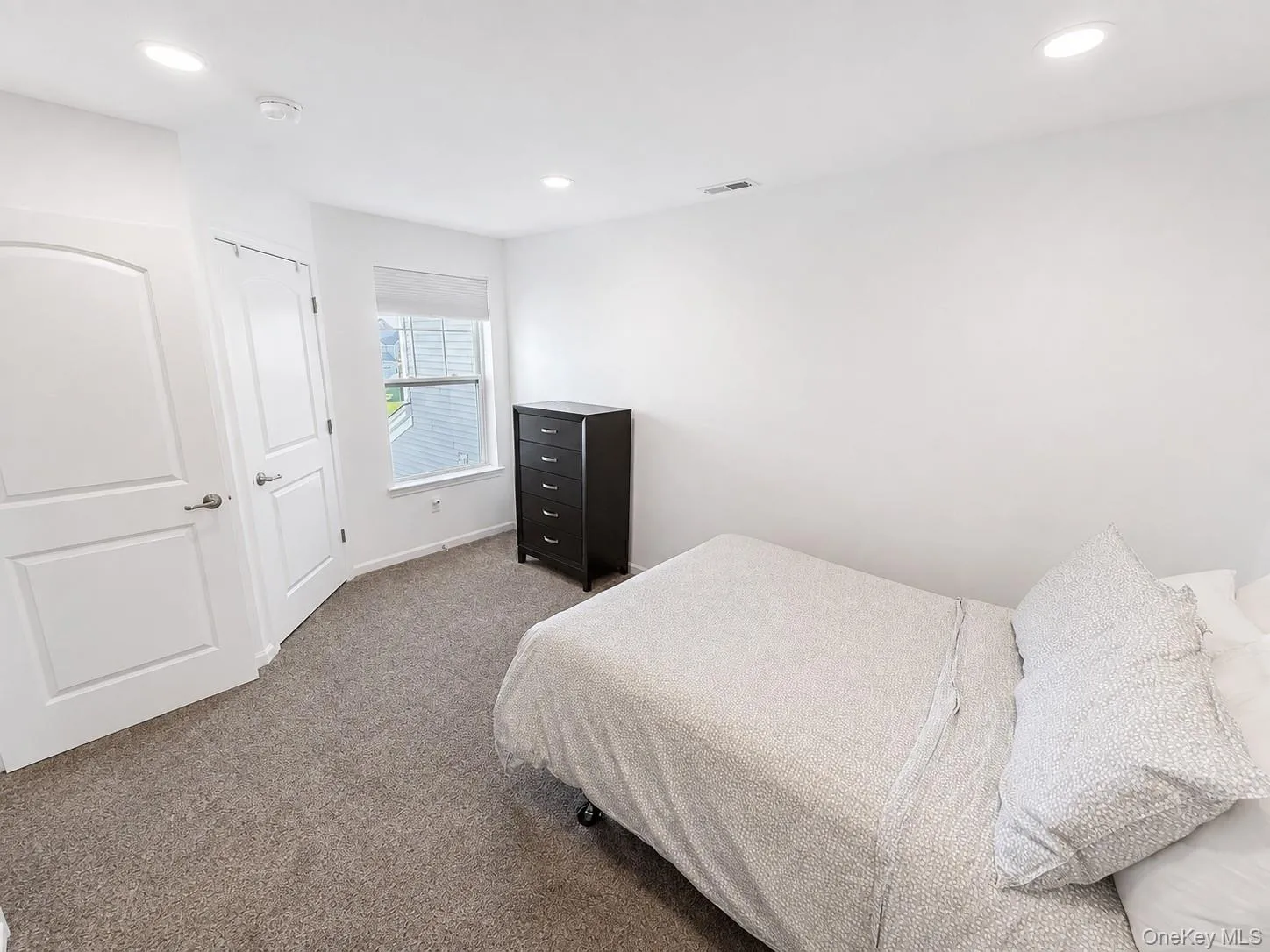 bedroom with a walk in closet bedroom with a walk in closet