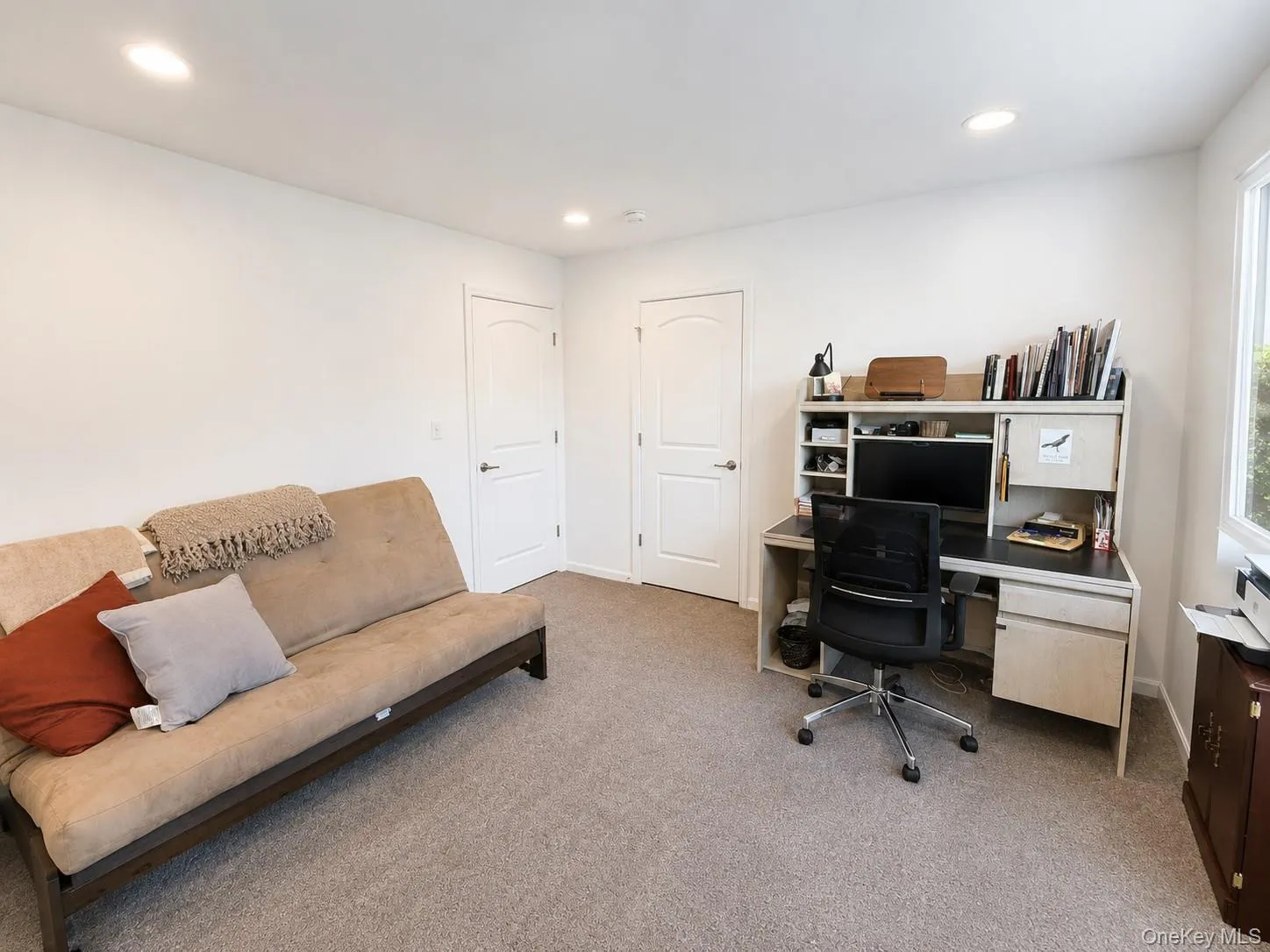 Set up as a home office with a walk in closet Set up as a home office with a walk in closet