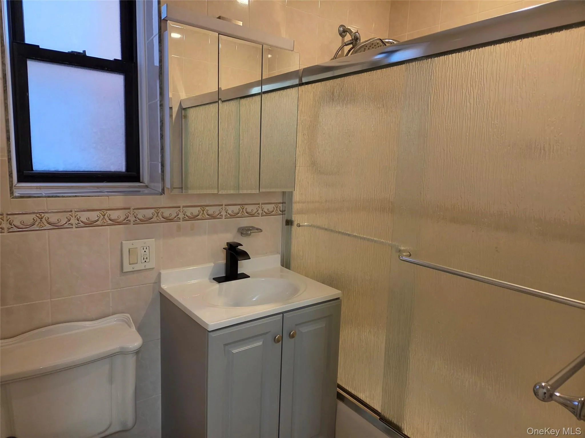 Updated windowed Bathroom with new vanity. Updated windowed Bathroom with new vanity.