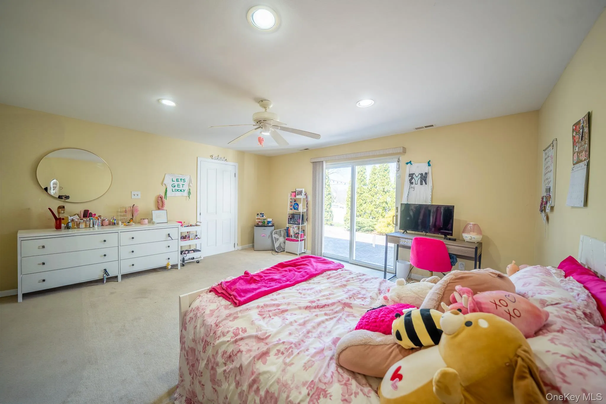 Bedroom featuring recessed lighting, carpet, ceiling fan, and access to outside Bedroom featuring recessed lighting, carpet, ceiling fan, and access to outside