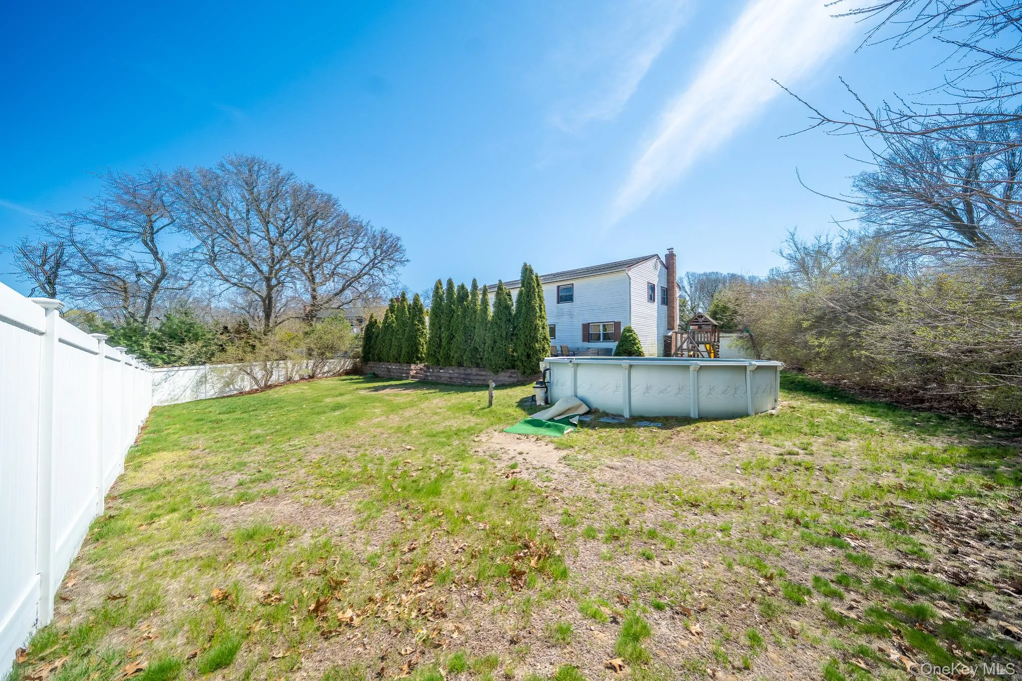 View of yard with a fenced backyard and a fenced in pool View of yard with a fenced backyard and a fenced in pool