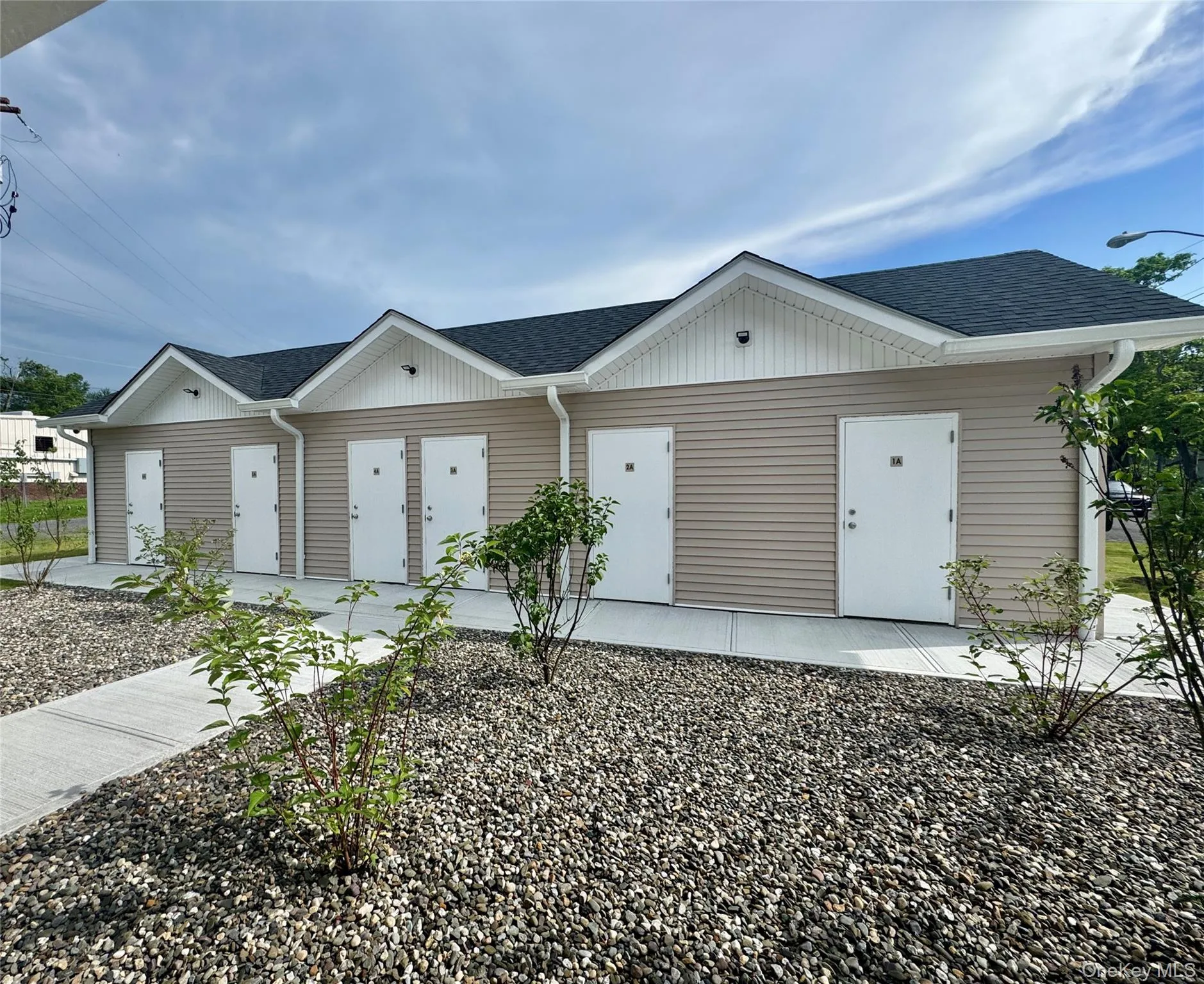 View of front of home featuring a shingled roof View of front of home featuring a shingled roof
