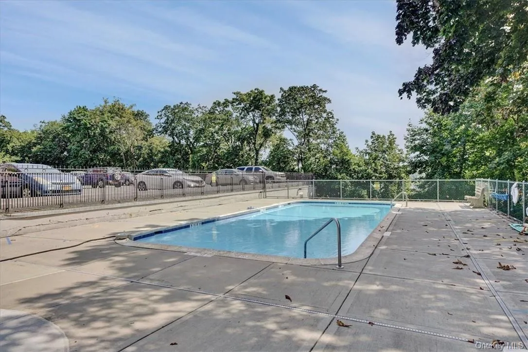 View of swimming pool featuring a patio View of swimming pool featuring a patio